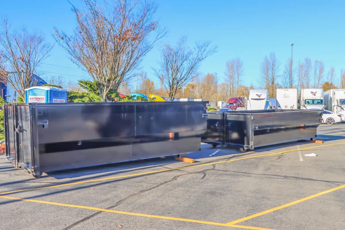 Professional dumpster rental service with roll-off container on residential driveway in Union City